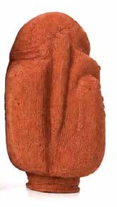 Small terracotta seed pod with a turned, rounded profile