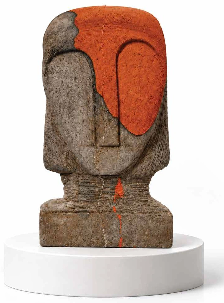 Grey seed pod sculpture with a terracotta face and orange pigment